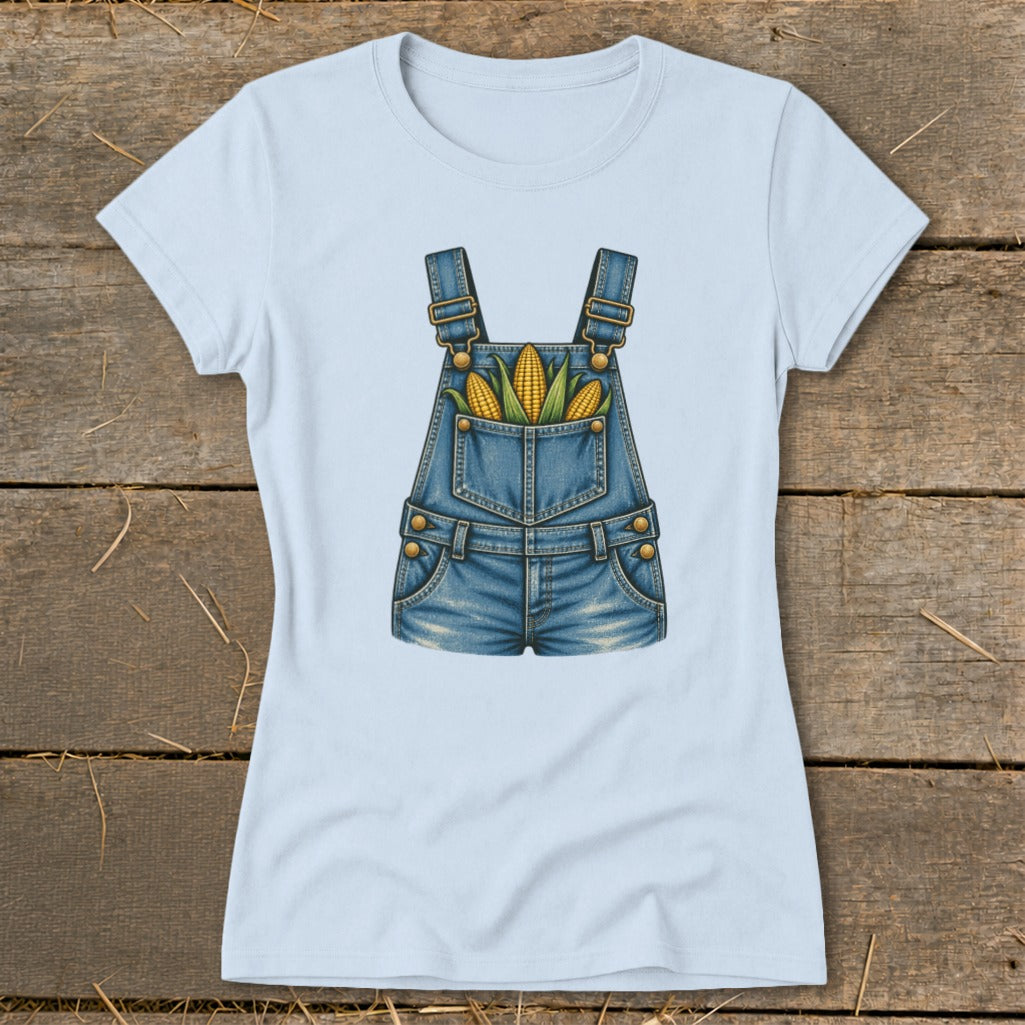 Light blue t-shirt with denim overalls graphic featuring corn in the pockets.