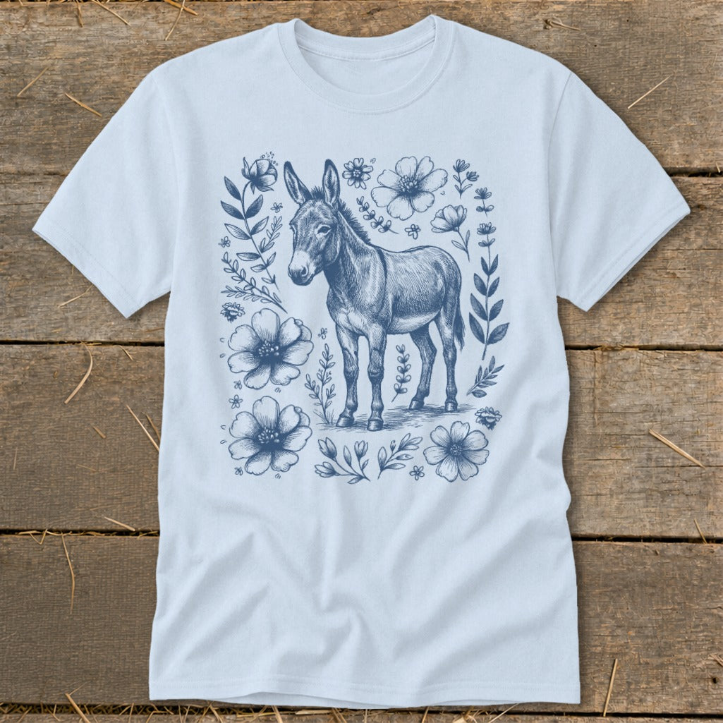 Light blue t-shirt with a blue sketch of a donkey surrounded by flowers.