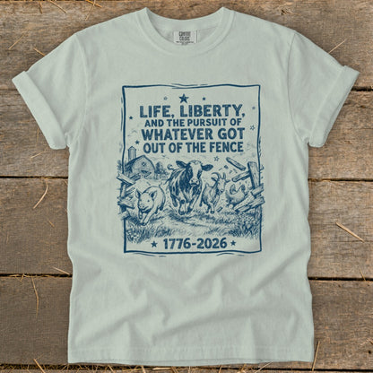 Shirt with "Life, Liberty, and the Pursuit of Whatever Got Out of the Fence 1776-2026" graphic.