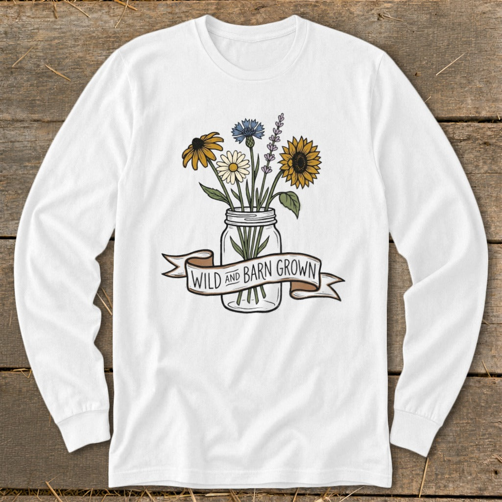 White long sleeve shirt with "Wild and Barn Grown" banner over a mason jar of wildflowers.