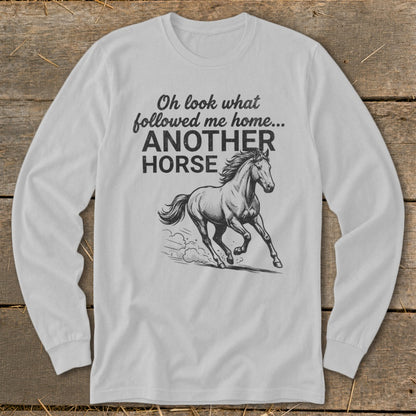 White long-sleeved shirt with "Oh look what followed me home... ANOTHER HORSE" text and horse graphic.