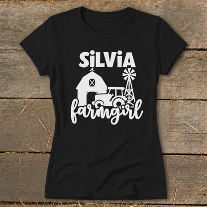 Black t-shirt with white text "SILVIA" above farm graphic and "farmingirl" text.