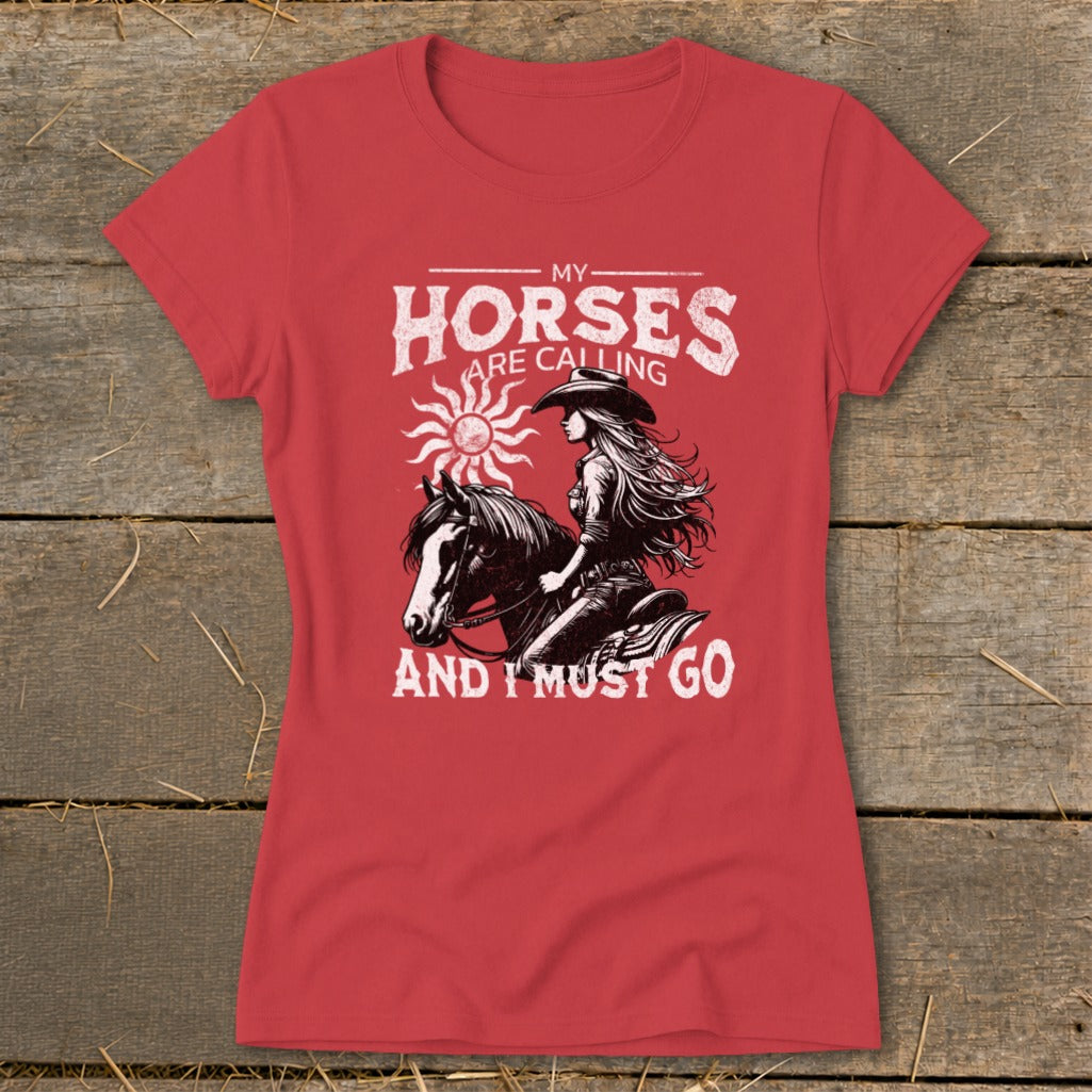 Red t-shirt with graphic of woman riding a horse and text "My Horses Are Calling and I Must Go."