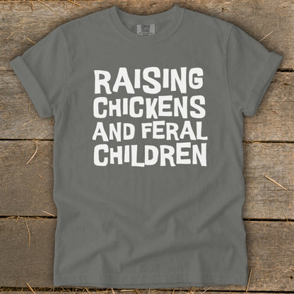 Gray t-shirt with white text reading "Raising Chickens and Feral Children".