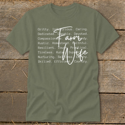 Olive green t-shirt with "Farm Wife" and descriptive words in white text.