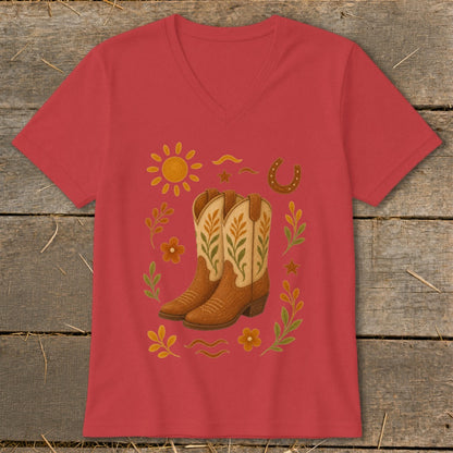 Red v-neck t-shirt with cowboy boots, sun, horseshoe, and floral accents.