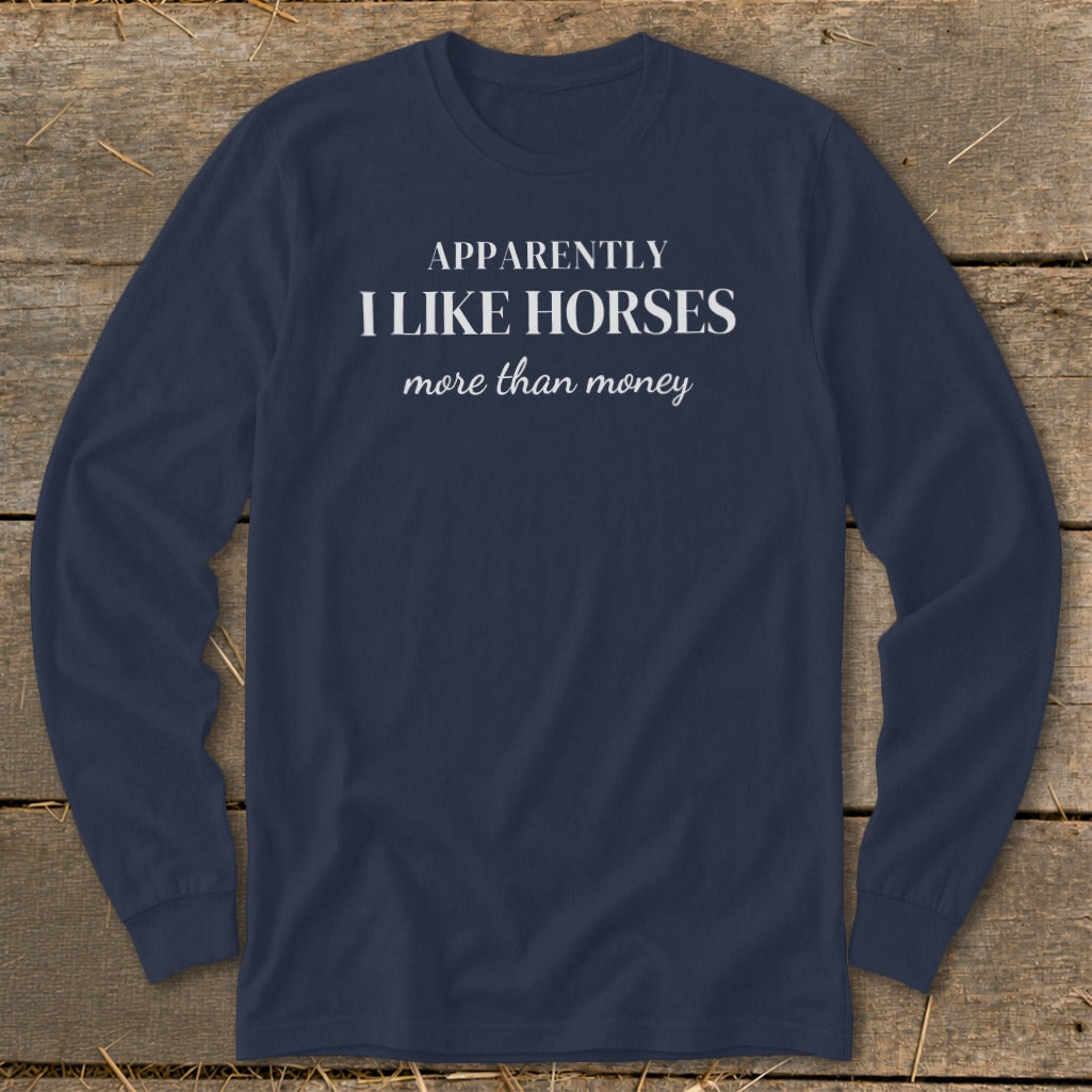 Navy long-sleeve shirt with white text: "APPARENTLY I LIKE HORSES more than money."