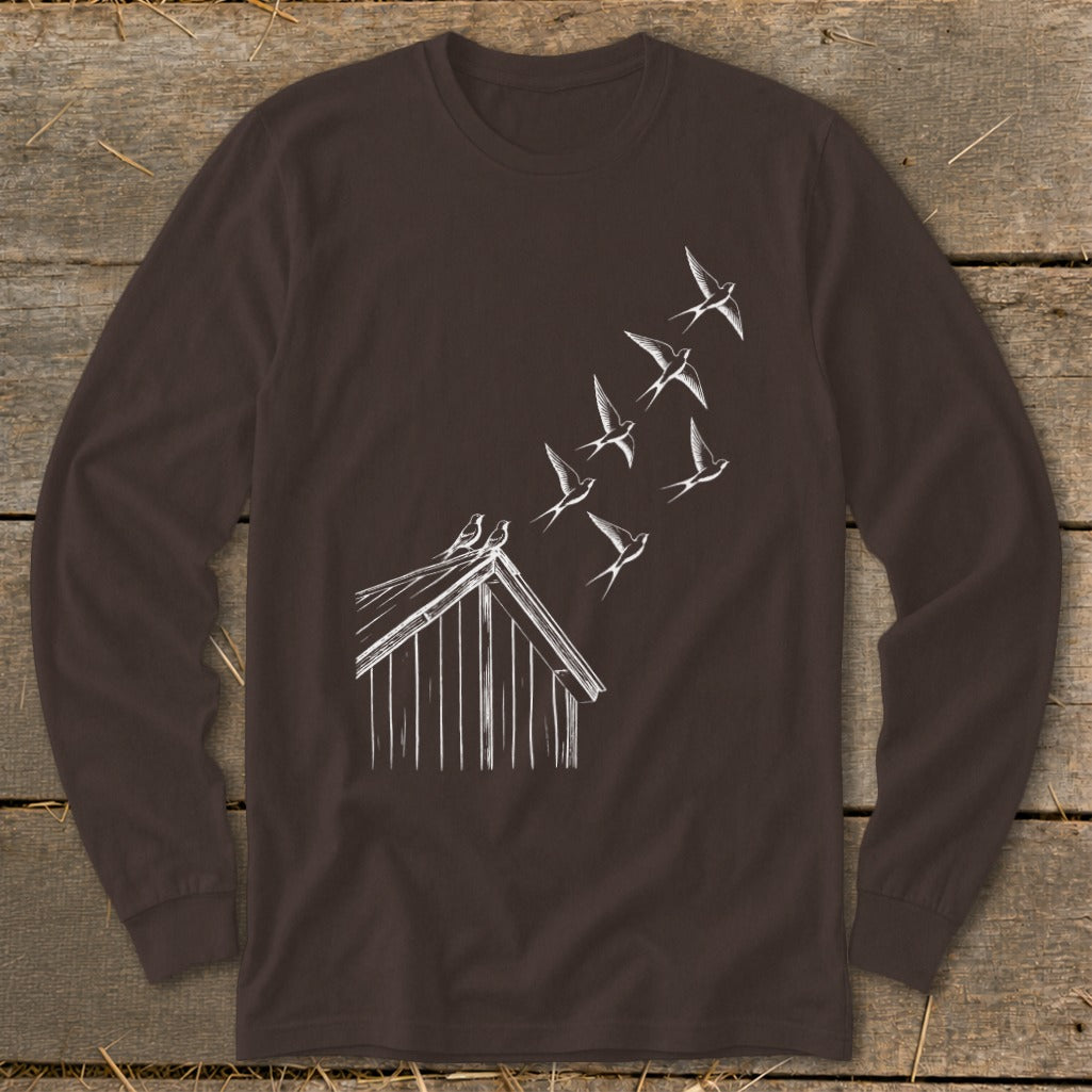 A dark brown long-sleeve t-shirt features a white sketch of birds flying from a barn roof.