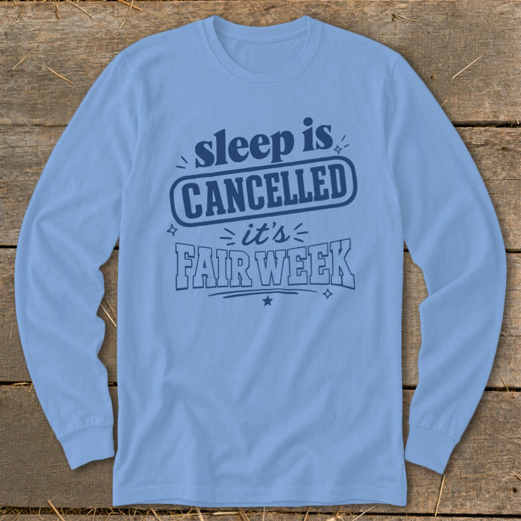 Light blue long sleeve shirt with "sleep is CANCELLED it's FAIR WEEK" text.