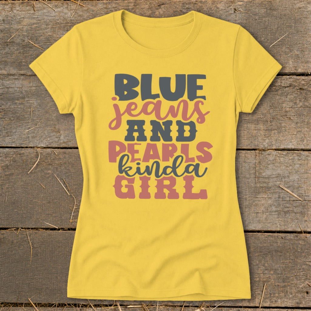Yellow t-shirt with "BLUE jeans AND PEARLS kinda GIRL" text graphic.