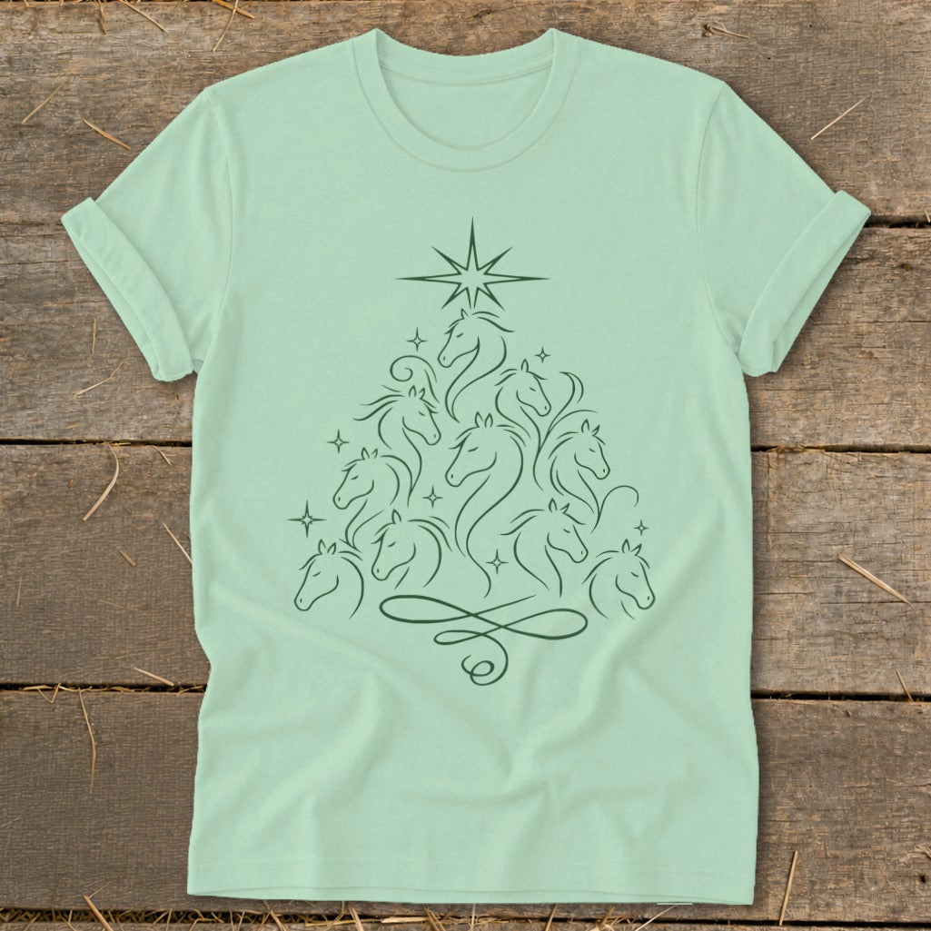 Light green t-shirt with a dark green line art of horses forming a Christmas tree.