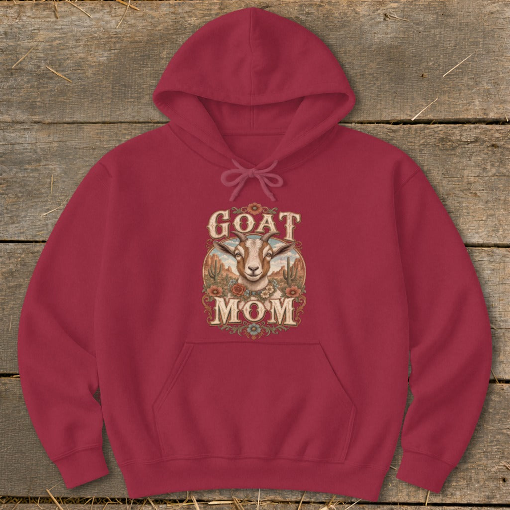 Maroon hoodie with "GOAT MOM" text and goat illustration on rustic background.