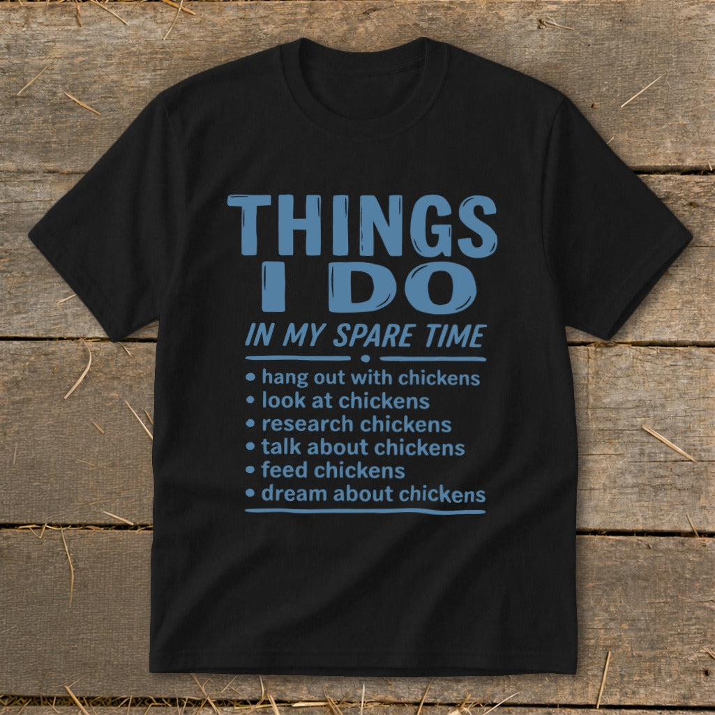 Black t-shirt with blue text listing chicken-related activities.
