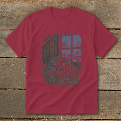 T-shirt graphic: cat sleeping on hay in barn by snowy window.