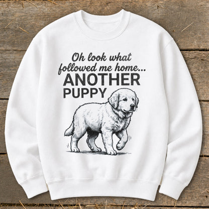 White sweatshirt with drawing of a puppy and text "Oh look what followed me home... ANOTHER PUPPY".