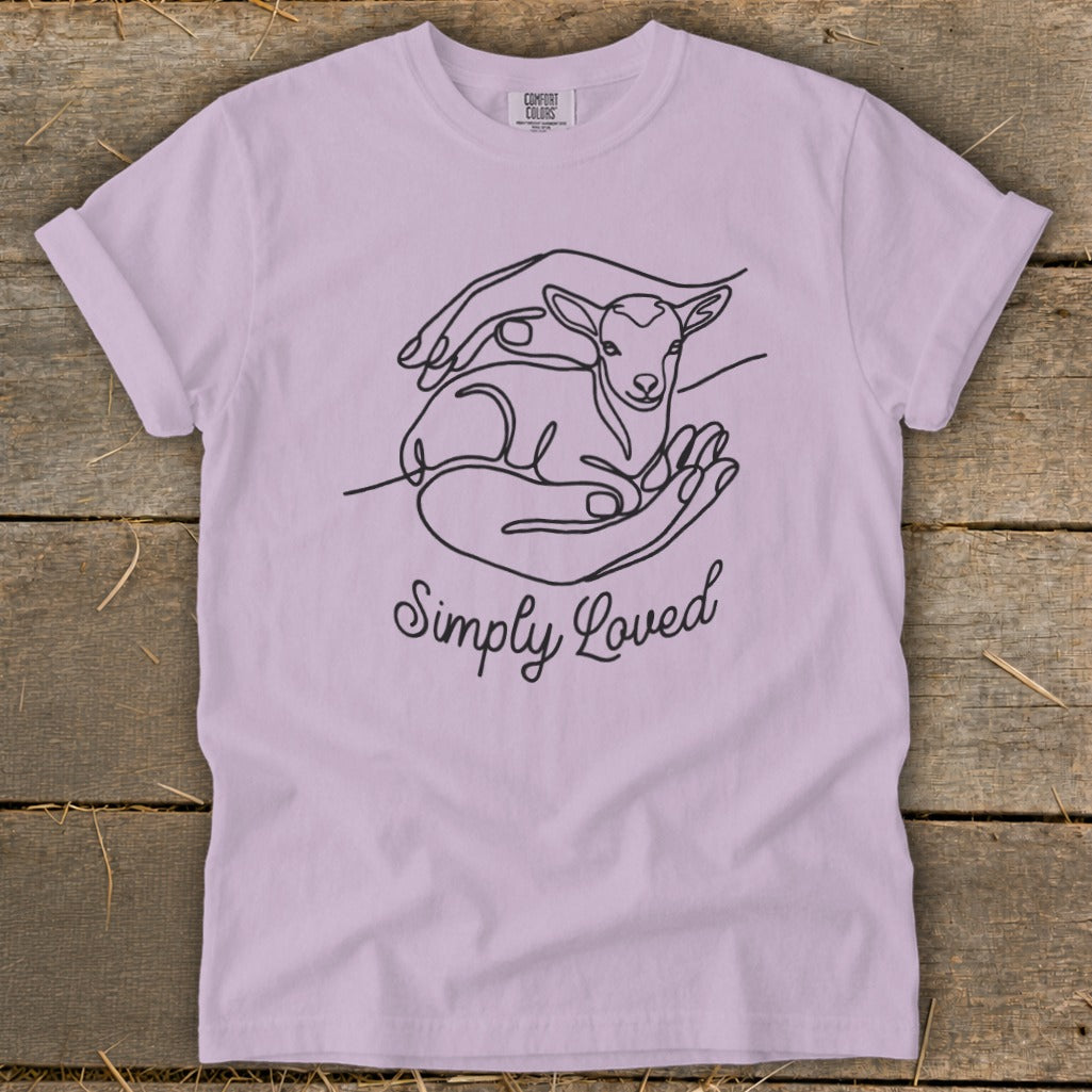 Purple t-shirt with line art of lamb in hands and text "Simply Loved".