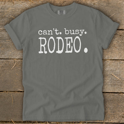 Gray t-shirt with white text "can't. busy. RODEO."