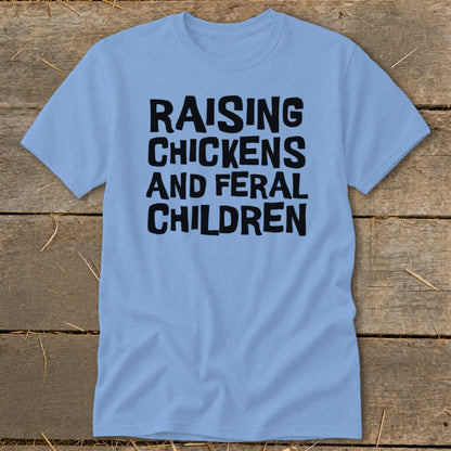 Light blue t-shirt with black text reading "RAISING CHICKENS AND FERAL CHILDREN".