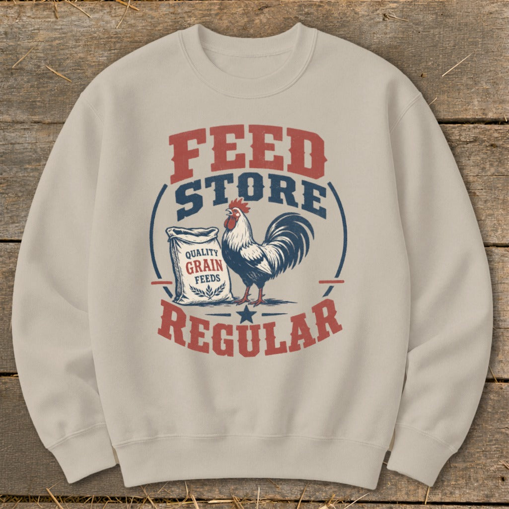 Cream sweatshirt with "Feed Store Regular" text, rooster, and grain bag graphic.