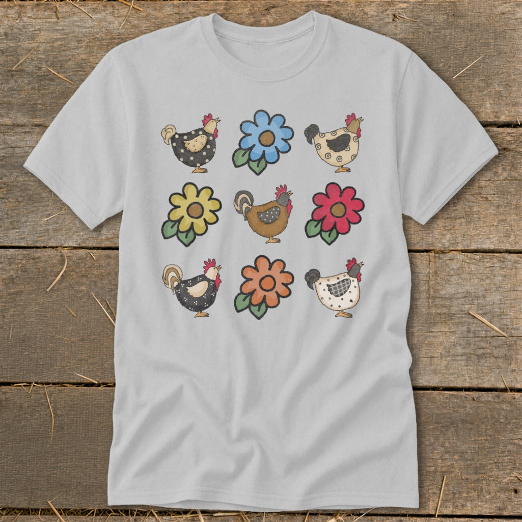 Gray t-shirt with a pattern of nine cartoon chickens and flowers.