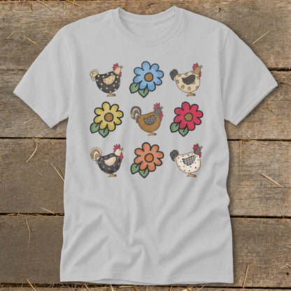 Gray t-shirt with a pattern of nine cartoon chickens and flowers.