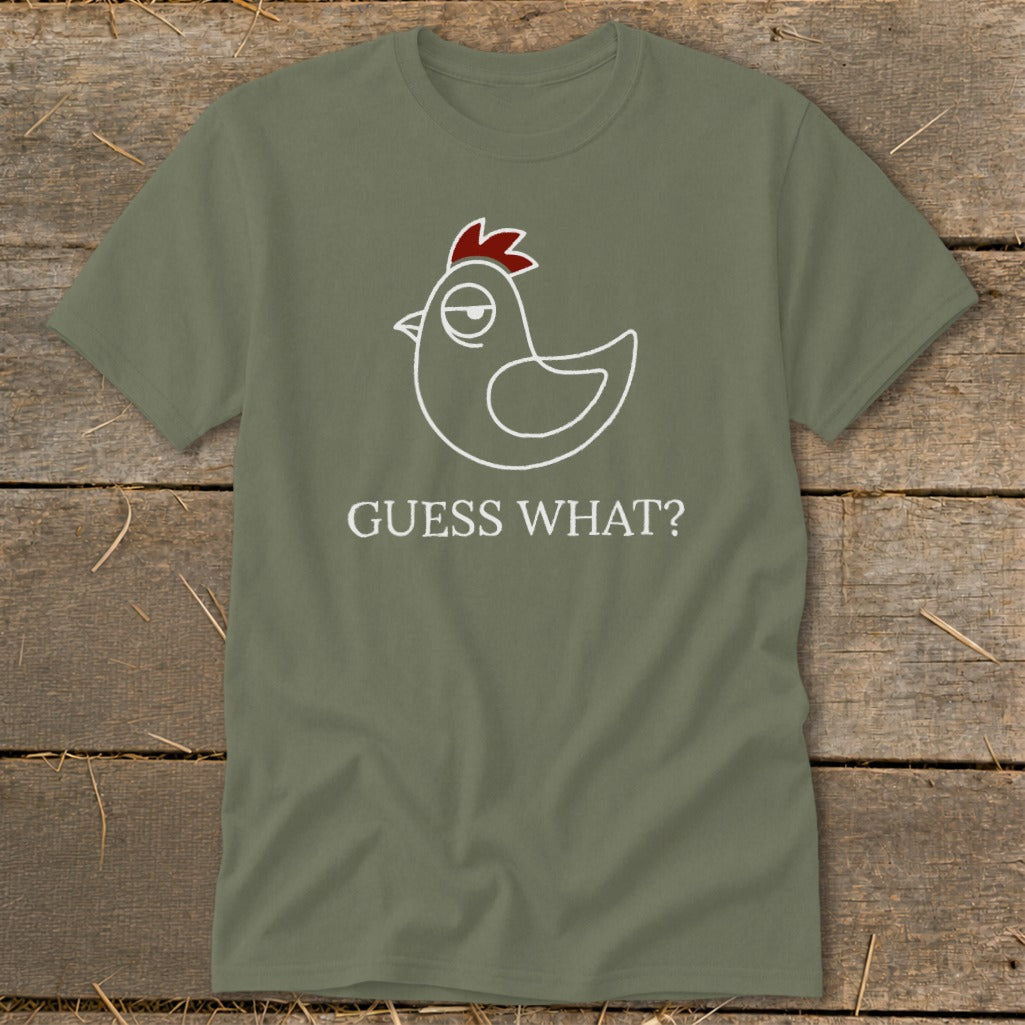 Green t-shirt with white outline of a chicken and the text "GUESS WHAT?".