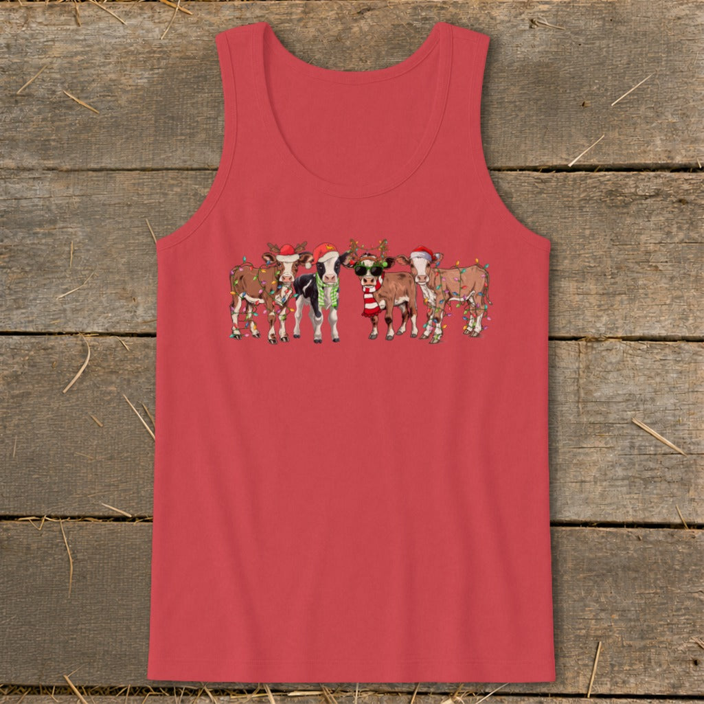 Five cartoon cows wear Santa hats and Christmas lights.