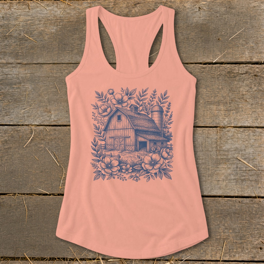 Peach tank top with a blue line drawing of a barn, silo, and floral elements.