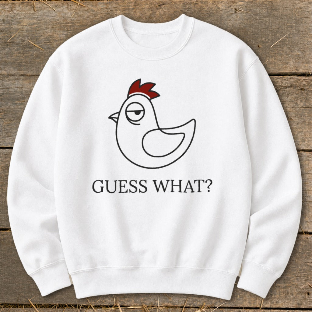 White sweatshirt with a cartoon chicken graphic and "GUESS WHAT?" text.