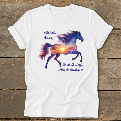 A white t-shirt features a running horse graphic filled with a sunset sky and quote text.