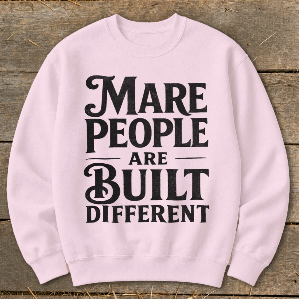 Light pink crewneck sweatshirt with black text "Mare people are built different".