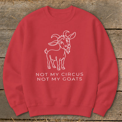 Red sweatshirt with a white outline of a goat and text "NOT MY CIRCUS NOT MY GOATS".