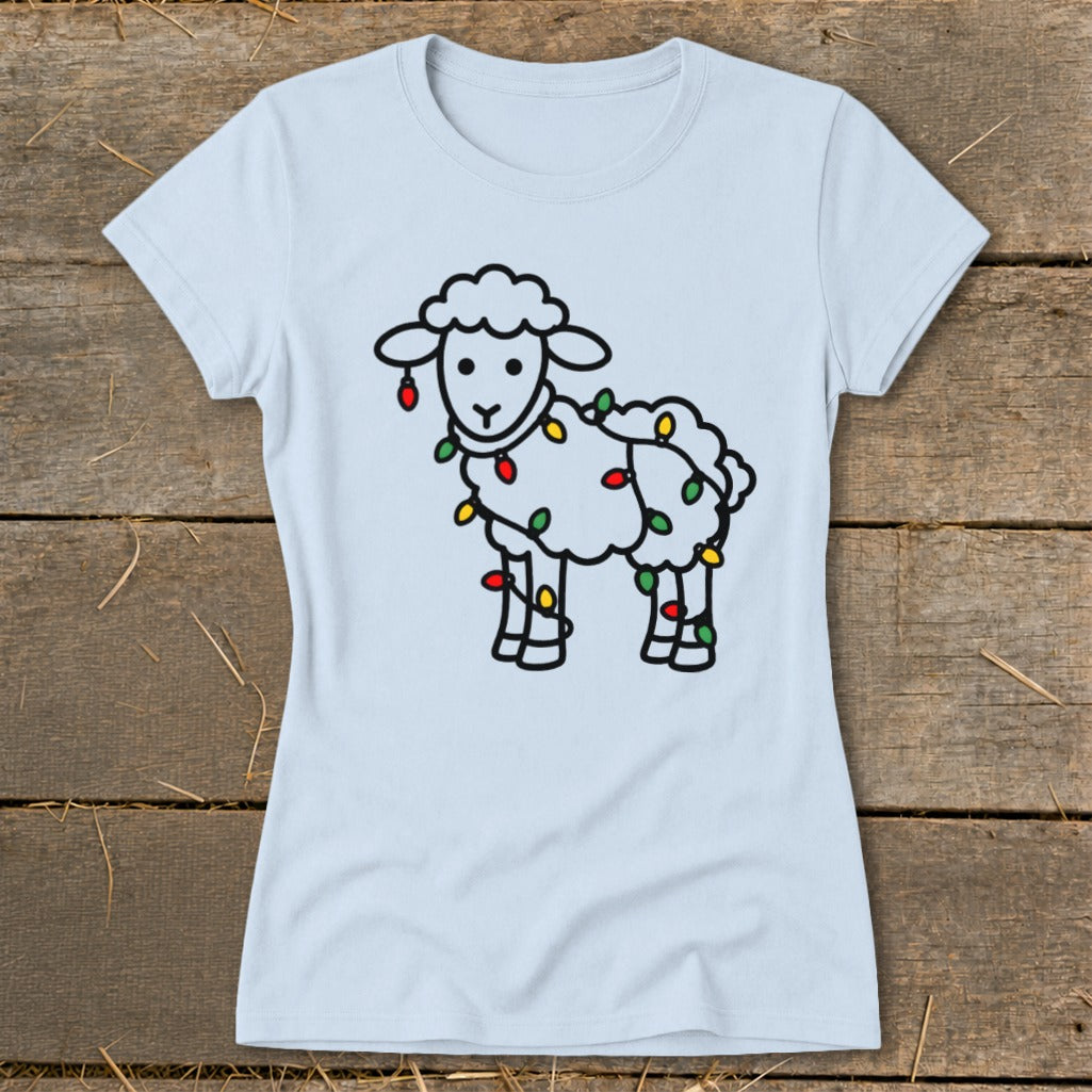 A light blue t-shirt printed with a cartoon sheep wrapped in colorful Christmas lights.