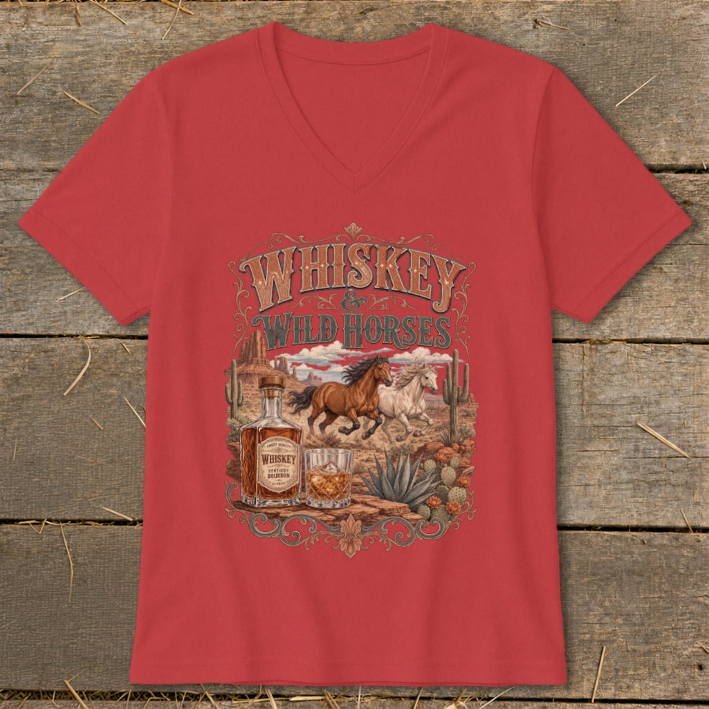 Red t-shirt with "Whiskey Wild Horses" design featuring running horses, whiskey bottle, and desert landscape.