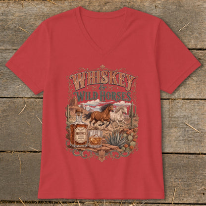 Red t-shirt with "Whiskey Wild Horses" design featuring running horses, whiskey bottle, and desert landscape.