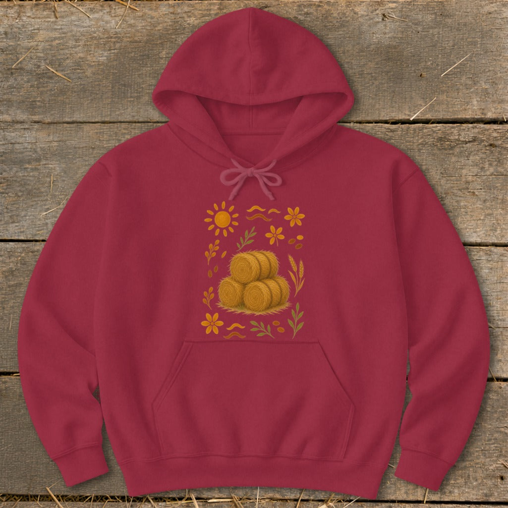 Maroon hoodie with a central print of hay bales, sun, and flowers.