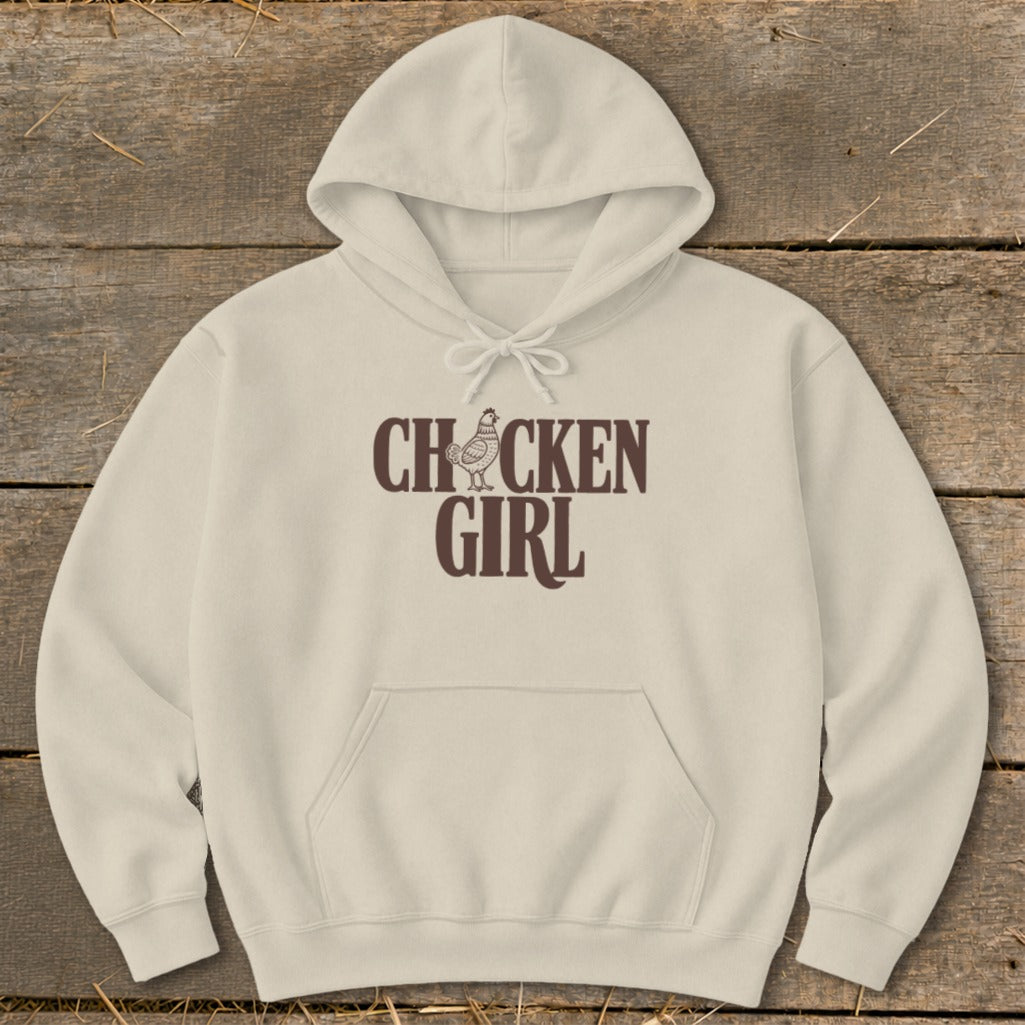Cream hoodie with brown "CHOCKEN GIRL" text and chicken graphic.