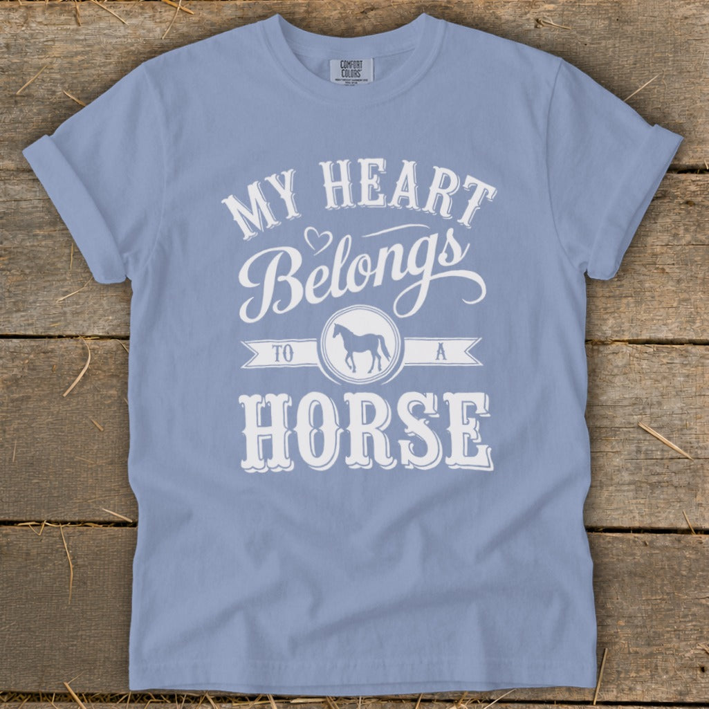 Light blue t-shirt with white text: "My heart belongs to a horse."