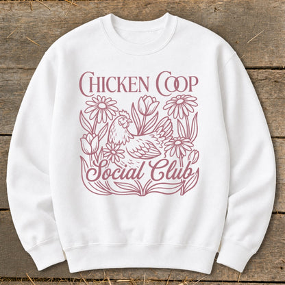 White sweatshirt with "Chicken Coop Social Club" text and a chicken surrounded by flowers.