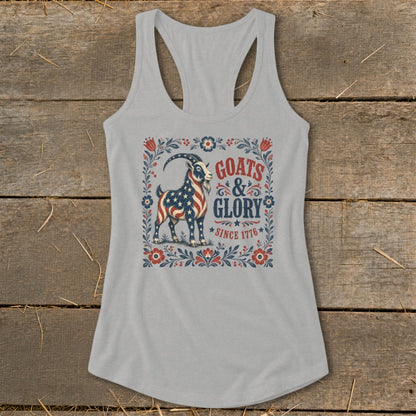 Light gray tank top with American flag goat graphic and text "GOATS & GLORY SINCE 1776".