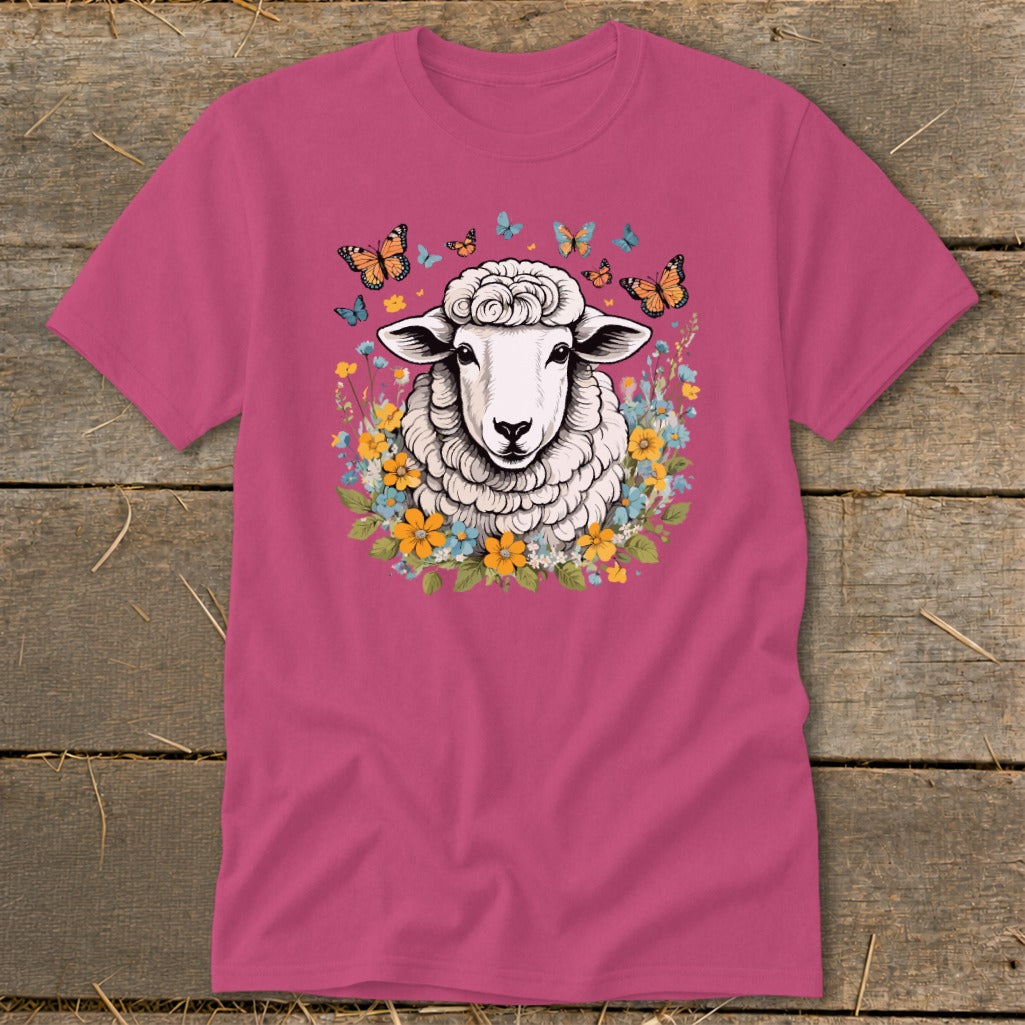 Pink t-shirt with sheep surrounded by flowers and butterflies graphic.