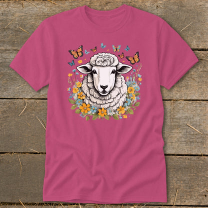 Pink t-shirt with sheep surrounded by flowers and butterflies graphic.