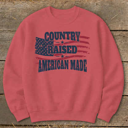 Salmon sweatshirt with "Country Raised American Made" and distressed American flag graphic.