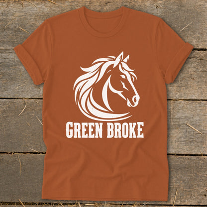 Rusty orange short-sleeved t-shirt featuring a white graphic of a horse's head and the text "GREEN BROKE".
