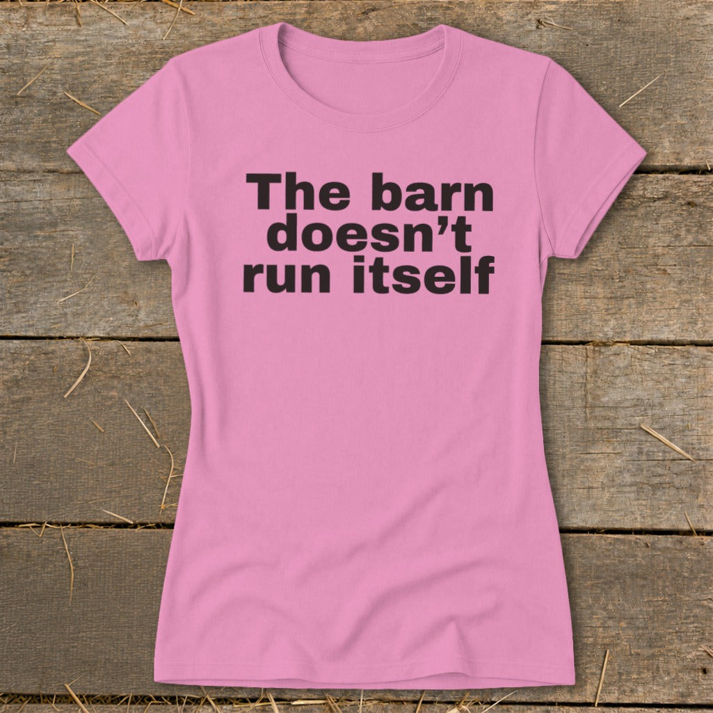 Pink t-shirt with black text that reads "The barn doesn't run itself".