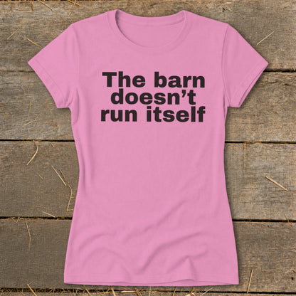 Pink t-shirt with black text that reads "The barn doesn't run itself".