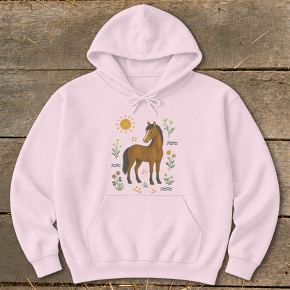 Pink hoodie with a brown horse, sun, and floral illustration.