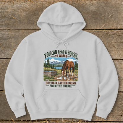 A light grey hooded sweatshirt featuring a graphic of a horse drinking from a puddle with text above and below.