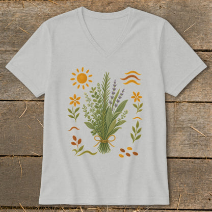 Light gray v-neck t-shirt with a bouquet of herbs surrounded by flowers, sun, and wavy lines.