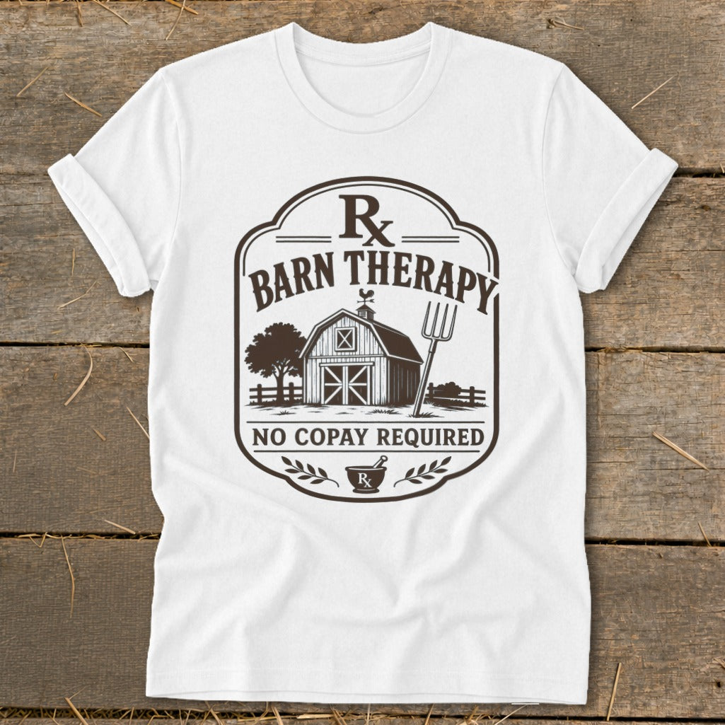 White t-shirt with "Barn Therapy" design featuring a barn, tree, pitchfork, and "No Copay Required".